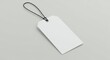 © rafliand - Elegant blank price tag mockup with string on a muted backdrop offers versatile space for custom