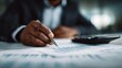© Thares2020 - A financial advisor reviewing charts and documents on a desk  long title A financial advisor examining business data charts and reports on a