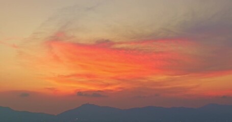 Wall Mural - A breathtaking sunset over a serene ocean beach, with vivid hues of orange, pink, and purple blending across the sky. Gentle waves roll onto the sandy shore, creating a peaceful and picturesque