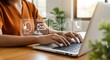 © Hussain - Professional customer support concept with businesswoman typing on laptop, displaying floating contact icons including email, chat, headset, and phone in modern office
