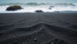 © Fa_art - Black sand beach closeup with ocean waves and rocky coastline in background, natural volcanic seascape, exotic coastal travel destination