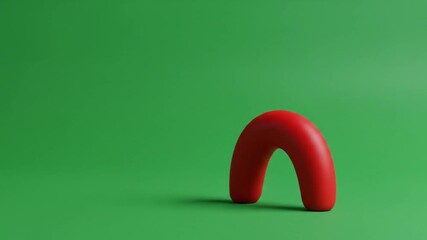 A vibrant red abstract shape against a smooth green background.