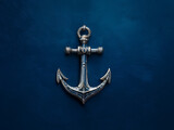 Metal ship anchor isolated on a solid background, studio photograph