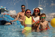 © New Africa - Happy family having fun at water park. Summer vacation