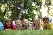 © New Africa - Cute little kids on green grass in park