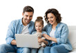 © Alaa stock - Joyful young family bonding at home, sharing smiles and laughter while engaging with a laptop, highlighting modern family life and togetherness.