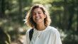 © SolaruS - Radiant woman smiling brightly, enjoying nature. Captures joy, vitality, and outdoor adventure. Ideal for wellness, travel, or lifestyle campaigns.Authentic look.