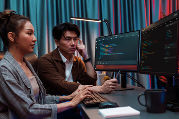 it developers discussing with point to intelligent website development coder system running data onl
