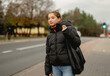 © tan4ikk - Girl Waiting For A Taxi Against The Blurred Backdrop Of A City In Spring