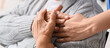 © Pixel-Shot - Nurse with senior woman in wheelchair holding hands in clinic, closeup