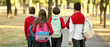 © Pixel-Shot - Group of pupils going to school outdoors, back view