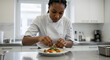 © ART.LAB.IA - Professional chef plating a dish in a modern kitchen