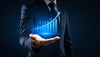 © 순단 강 - A man in a suit has one hand outstretched against a dark background, with a glowing, rising blue line chart on his hand