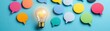 © taweesak - Colorful speech bubbles with a glowing light bulb symbolizing ideas communication and creativity on vibrant blue background with diverse discussion concepts