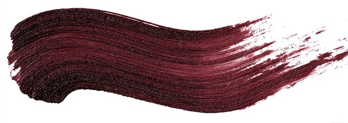 A swath of deep burgundy paint or cosmetic product, applied with a brush, is displayed against a white background