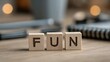 © Hapun - Fun word on wooden blocks concept joy and entertainment