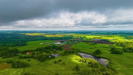 Wall Mural - Dense Clouds Passing Over Countryside Landscape. Timelapse