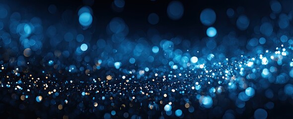Abstract bokeh background with blue and gold glitter