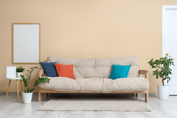 Poster - sofa, houseplants and frame on wall in interior of living room