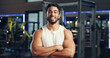 © peopleimages.com - Crossed arms, fitness and portrait of man in gym with confidence for workout, bodybuilding or training. Health, personal trainer and male person from Mexico with pride for exercise in sports center.