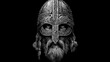 © axalaimaxala - Ancient Viking warrior helmet with intricate carvings on black background.