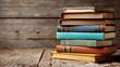 © Kitta Studio - Stack of Hardcover Novels on a Weathered Wooden Desk Surface