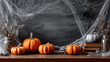 © Алексей Иванченко - Classroom halloween celebration with pumpkins and spiderweb on chalkboard. concept of festive atmosphere, school decor, autumn event