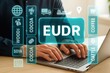 © Media Srock - A person uses a laptop computer to access a digital display of agricultural commodities and the acronym JUDR.