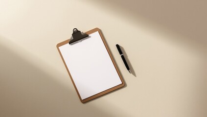 Clipboard with document and pen in beige workspace flatlay.