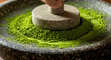 Hand grinding matcha in stone mill