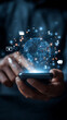 © Rakib - Person's hands holding a smartphone with a luminous digital globe and financial symbols in a network