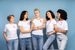 © Maria Vitkovska - Diverse women embracing and supporting breast cancer awareness