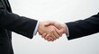 © Azwardi - Professional handshake between two businessmen in formal suits, symbolizing a successful partnership, agreement, or sealed deal