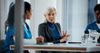 © Lahoud25/peopleimages.com - Doctors, discussion and business woman in meeting for hospital manager, surgery schedule and healthcare. Medical, planning and nurses with mature person in boardroom for clinic report and team
