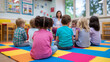 © Curioso.Photography - Group of children sitting on colorful floor mats in kindergarten listening to teacher.