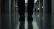 © SweaterWeather - Low Angle Shot of Walking Legs on Gleaming Tiled Floor In Dark Hallway