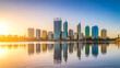 A panoramic cityscape photograph of Perth, Australia at sunrise, captured from across the Swan River