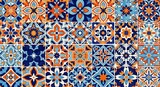Intricate geometric tile pattern with blue, orange, and white floral motifs