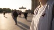© Sheng - White shirt with black-red-gold lapel pin, shallow focus on blurred Brandenburg Gate in morning light.