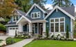 © thiquynh - A navy blue craftsman-style home with white trim, large windows, and green grass in the front yard