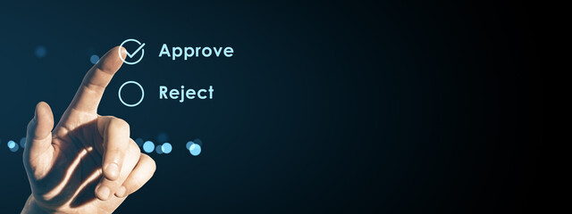 Human finger pressing virtual approve button on digital interface screen with reject option on dark neon background for modern technology concept.