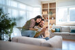 © Migma_Agency - Happy couple making online payment using credit card and smartphone at home