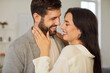 © Studio Romantic - Portrait of a young couple in love looking at each other with tenderness standing at home. Happy affectionate pair hugging enjoying being together. Romantic, relationship and Valentines day concept.