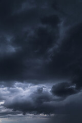 Wall Mural - Epic Dramatic Storm sky with dark blue gray black cumulus rainy clouds abstract background texture, thunderstorm