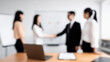 © Mselected - Business negotiation meeting with colleagues discussing deals in a modern office