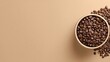 © Juhamsir - A beige bowl overflows with dark roasted coffee beans, spilling onto a matching background, leaving ample negative space