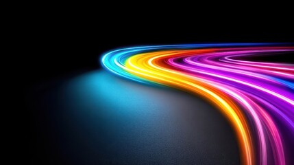 Wall Mural - Colorful light trails on a dark background creating a vibrant abstract pattern.
