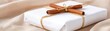 © Enjoy - Beautifully wrapped Christmas gift in white linen fabric, tied with twine and adorned with cinnamon sticks