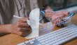 © cherdchai - Man working with AI agents interface digital dashboard and analytics charts, showing data visualization and command prompt representing artificial intelligence support for daily task data management
