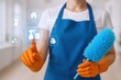 © The Little Hut - Professional cleaner selecting cleaning tasks with futuristic interface, wearing an apron and holding a duster